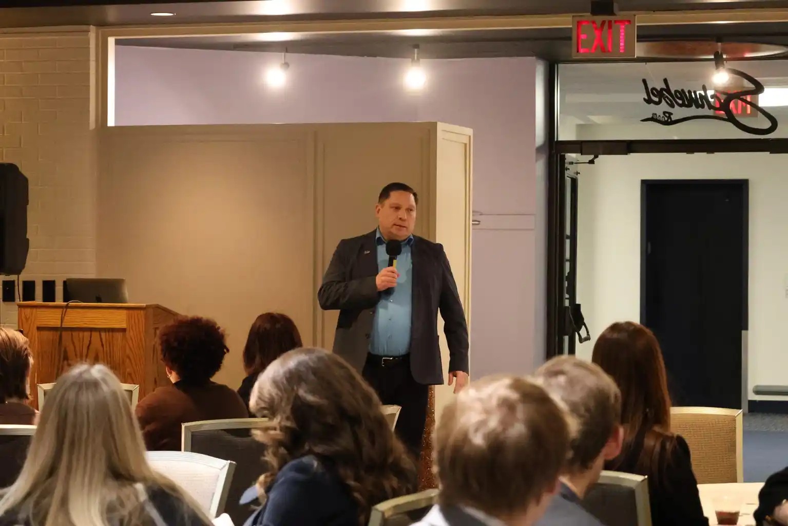 Kyle Patrick Smith speaking at an event