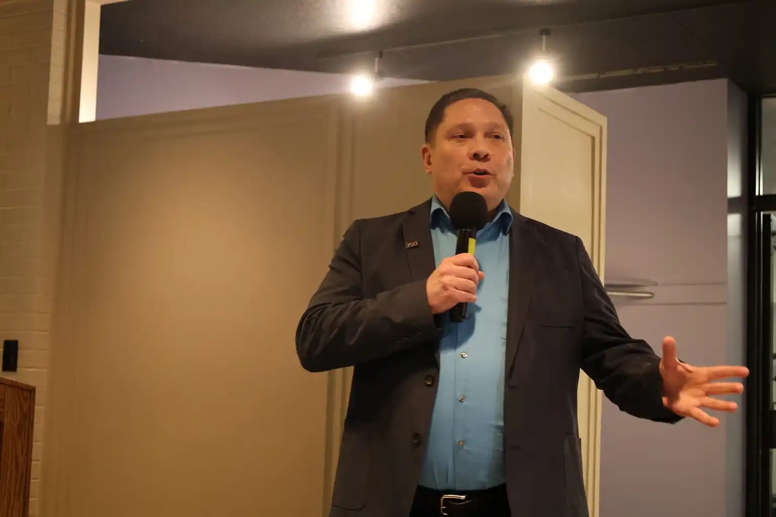 Kyle Patrick Smith speaking at an event