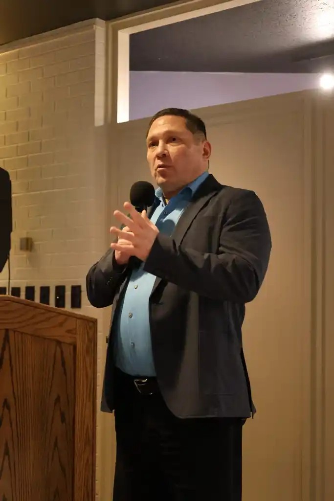 Kyle Patrick Smith speaking at an event