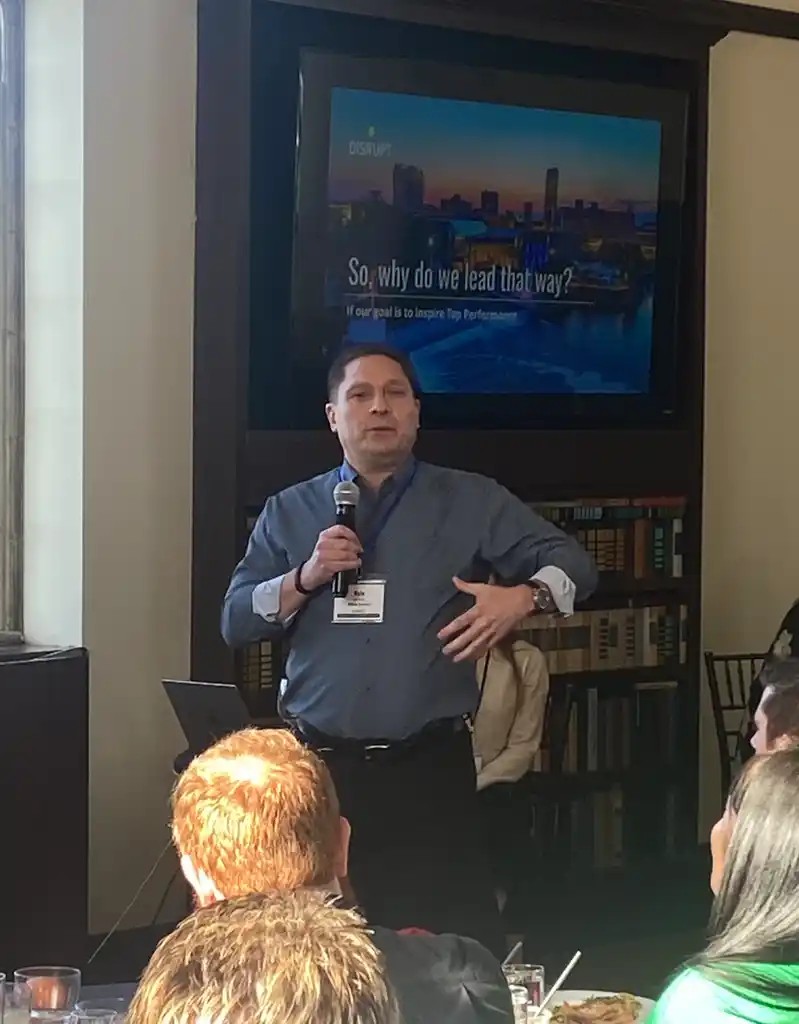 Kyle Patrick Smith speaking at an event